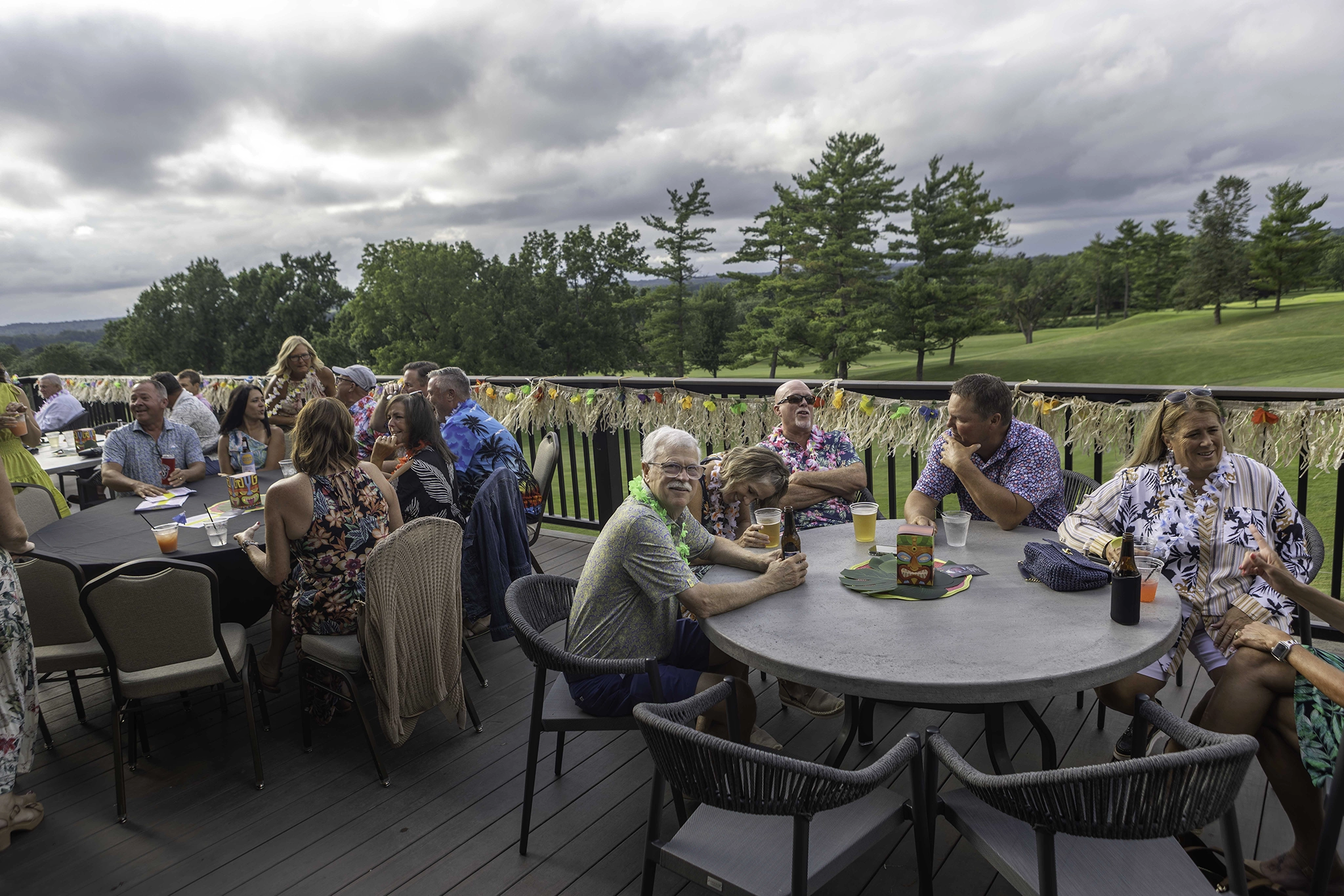 Photo of a gathering of members and guests at SCC on the patio